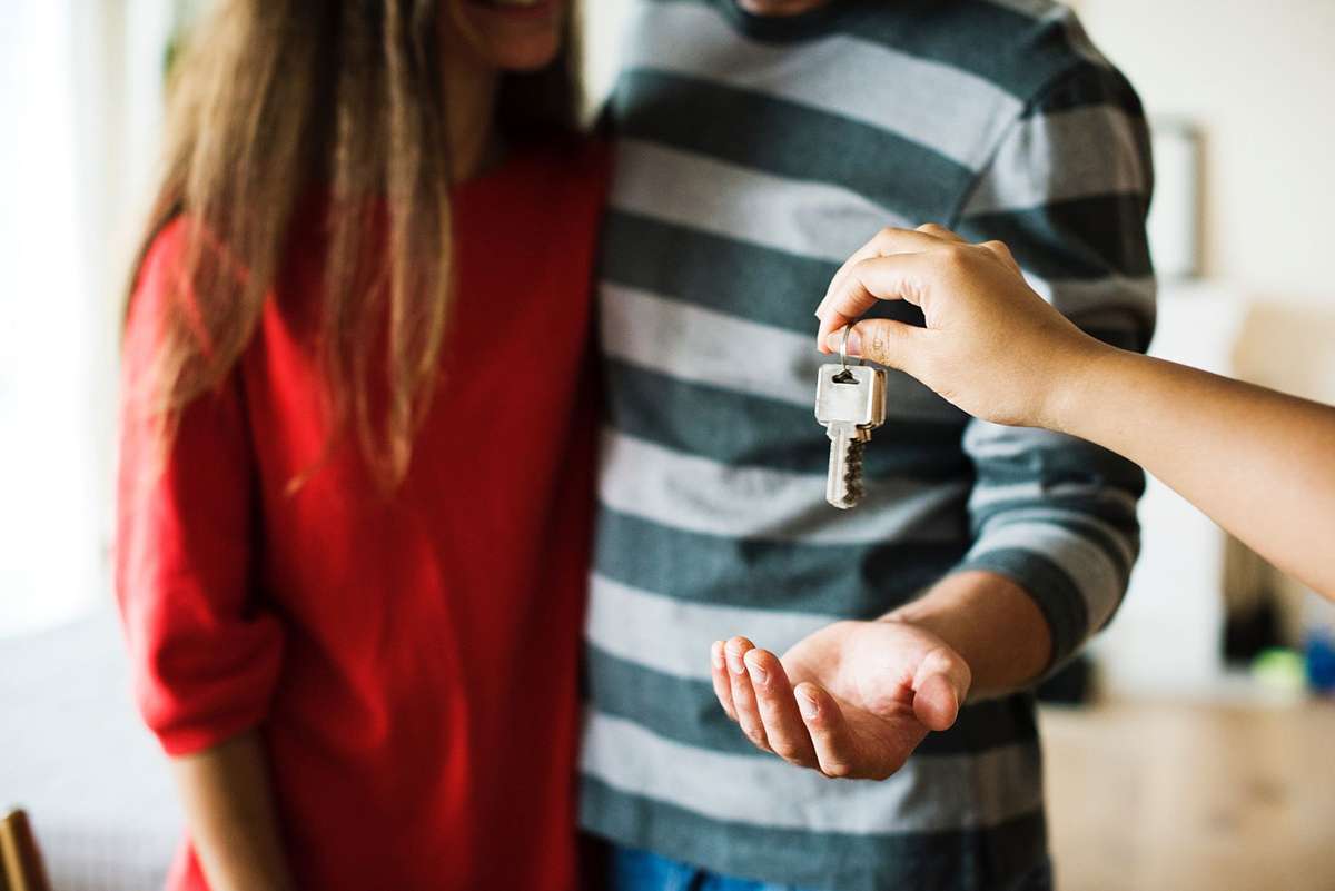 Couple being handed house keys